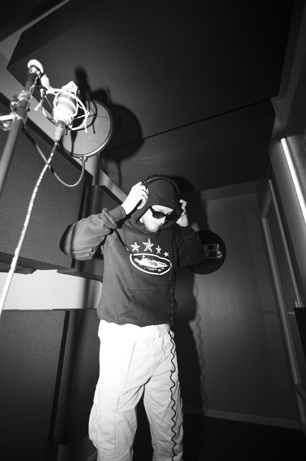 Technician setting up broadcast studio equipment