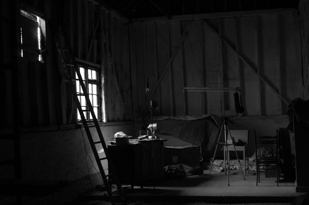 Empty television studio set with overhead lighting grid